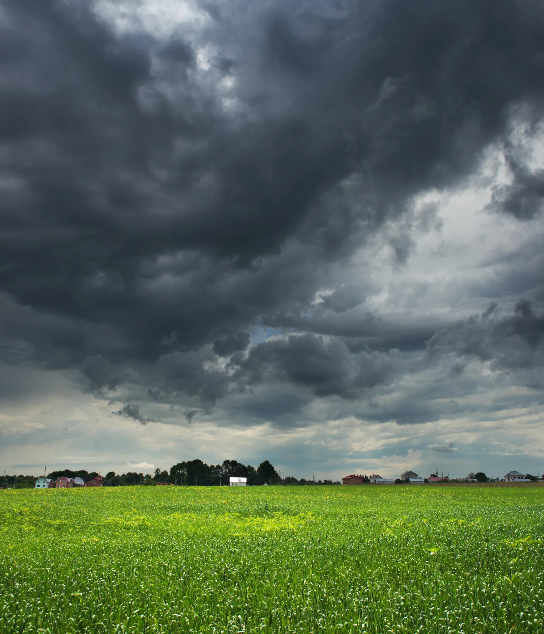Dark storm clouds over a rural service area